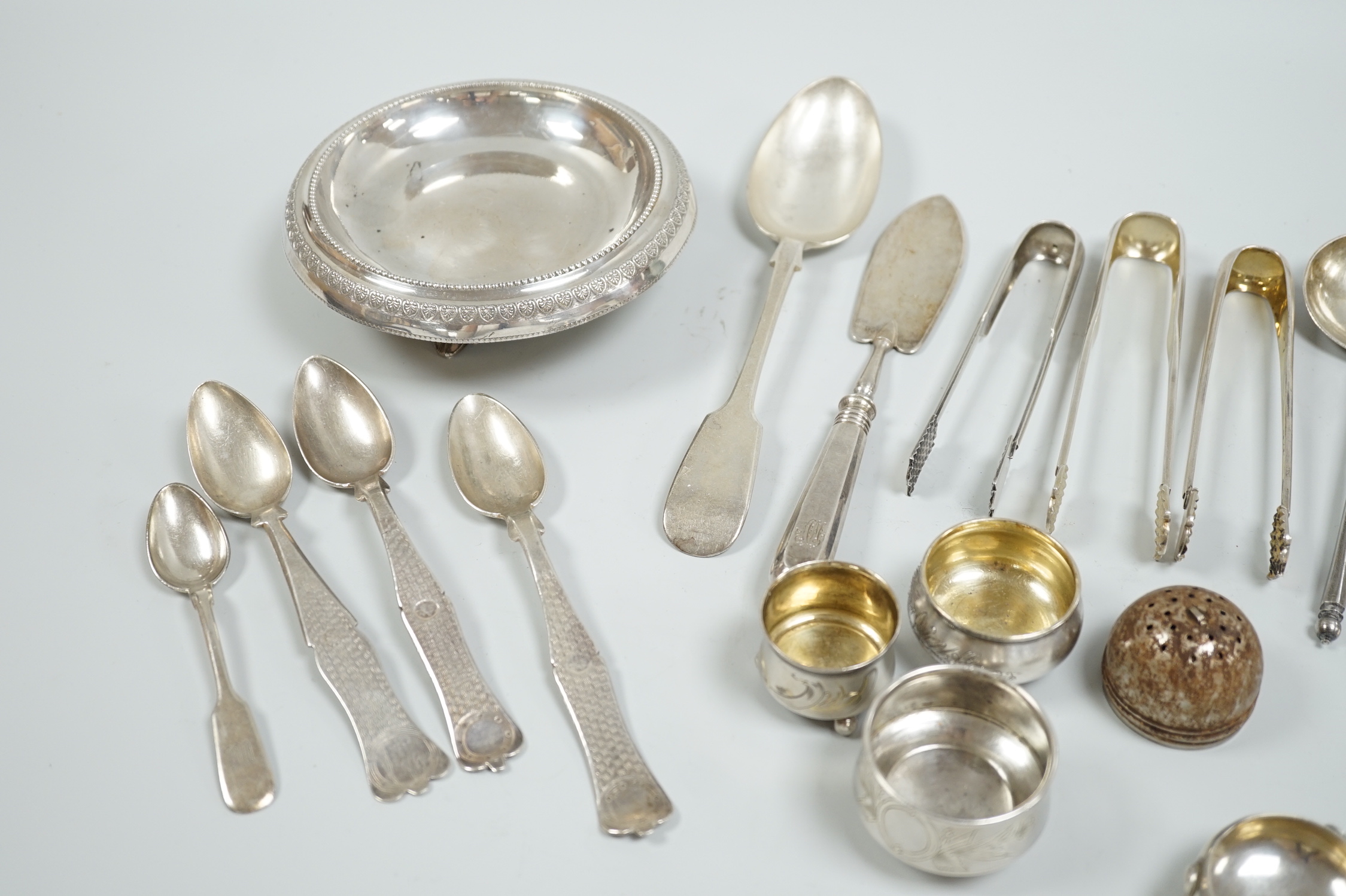 Miscellaneous white metal and plated cutlery including Russian and four small white metal salts including Russian and a plated dish.